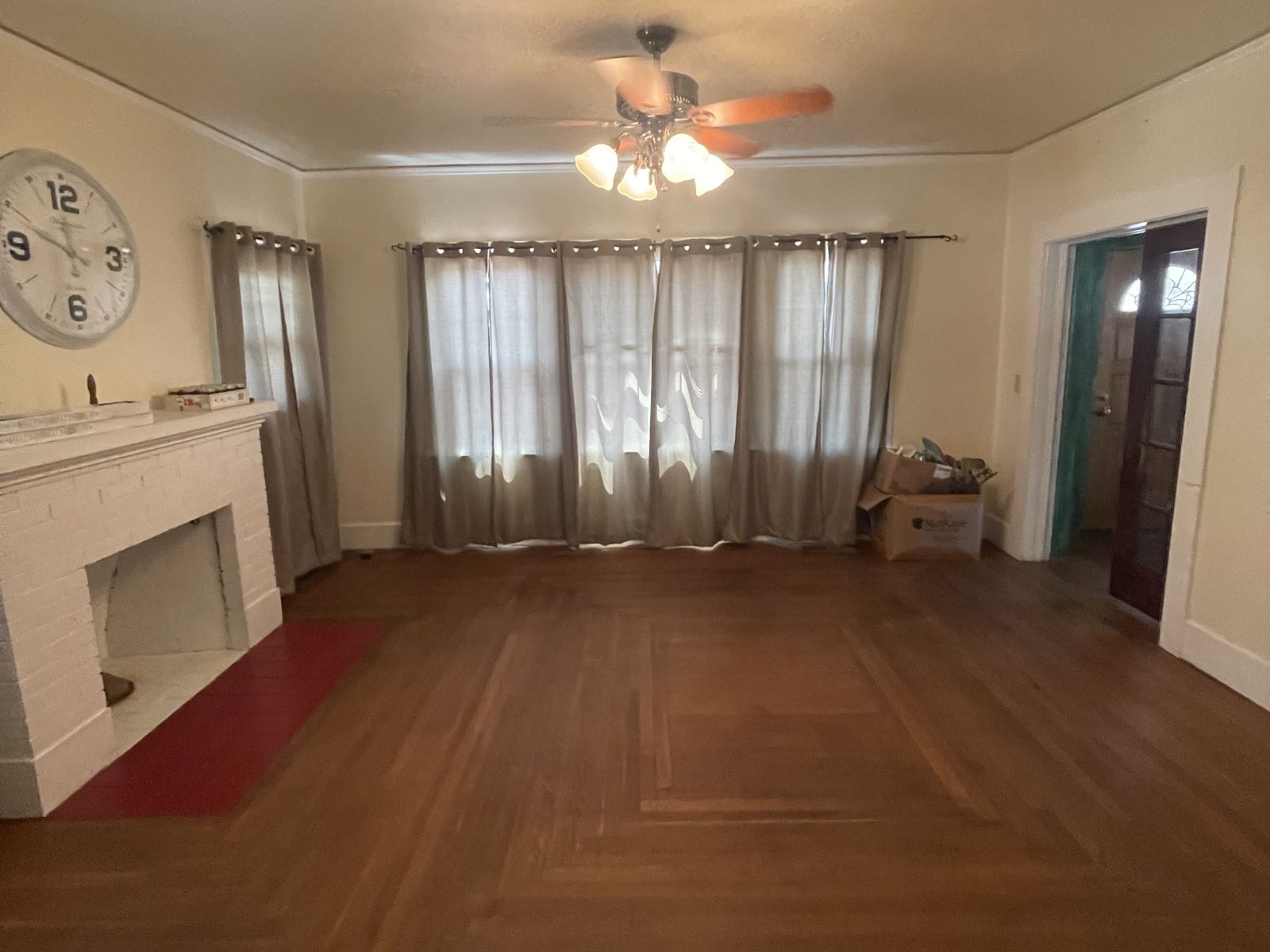Almond Street living room with original hardwood floors and built-in cabinetry
