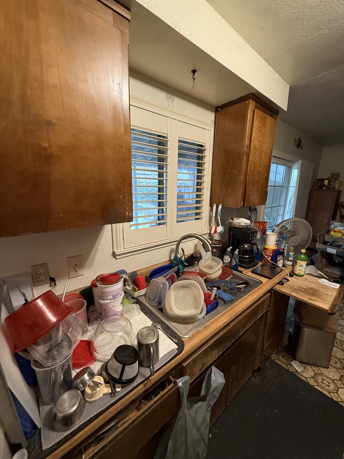 Local probate home listed as-is by Yuba Sutter Real Estate Group — cluttered kitchen
